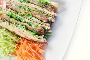 sandwiches with meat and vegetables on  plate