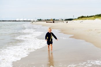 Little boy  playing on  sea beach