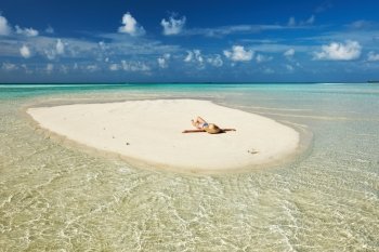 Woman in bikini at tropical beach 