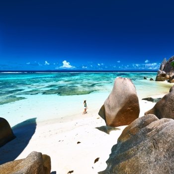 Woman at beautiful beach at Seychelles