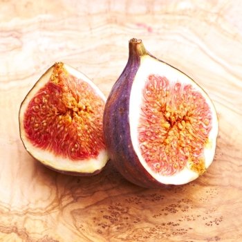 Fresh figs on rustic vintage wooden table