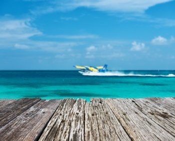Twin otter seaplane at Maldives and old wooden pier