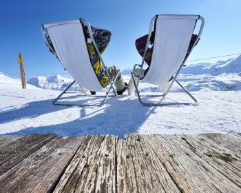 Couple at mountains in winter, Val-d’Isere, Alps, France