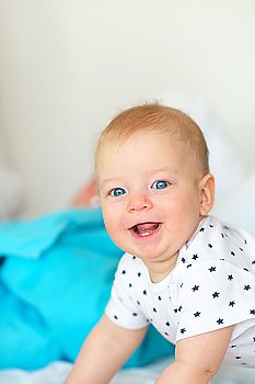 Six months old baby with blue eyes