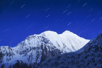 Mountain and star trails on the night sky