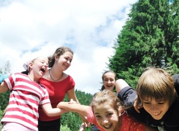 happy children group  have fun outdoor in nature at suny day