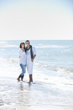 happy young couple in white clothing  have romantic recreation and   fun at beautiful beach on  vacations
