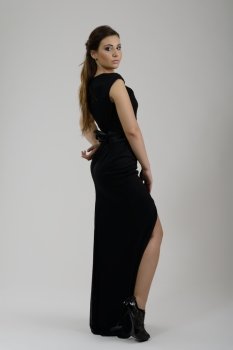 elegant woman in  fashionable  stylish dress posing in the studio