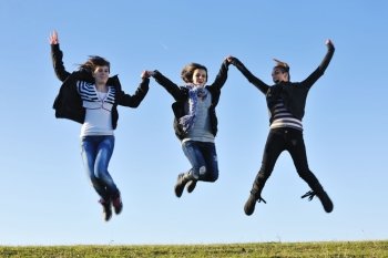 group of teen people woman  have fun outdoor with blue sky in background