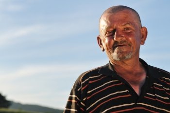 senior old man portrait outdoor at sunset