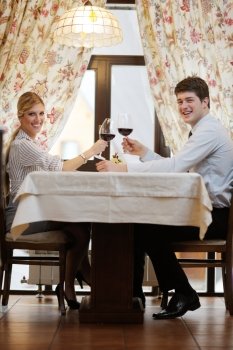 A young couple having romantic  dinner at a restaurant