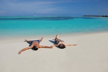 happy young asian couple have fun and romantic time at  summer on beautiful white sand beach