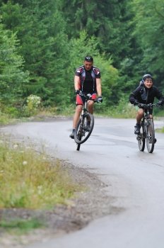 two friends have fun outdoor in nature and representing concept of  healthy life and fitnes on muntain bike 