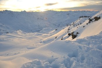 mountain snow fresh sunset at ski resort in france val thorens 