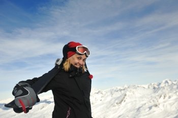 happy young woman have fan while relaxing at snow with ski and snowboard sport at winter seasonyoung athlete man have fun during skiing sport on hi mountain slopes at winter seasson and sunny day
