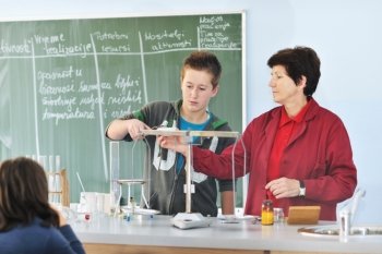 science and chemistry classees at school with smart children and teacher 