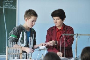 science and chemistry classees at school with smart children and teacher 