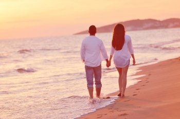 happy young romantic couple in love have fun on beautiful beach at beautiful summer day