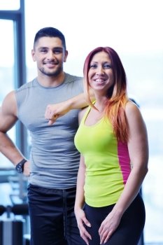 attractive couple at the gym looking happy