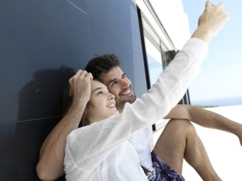 cheerful happy young couple making selfie together at home