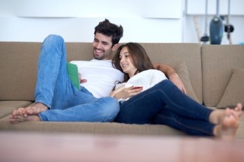 romantic relaxed young couple at modern home using tablet computer