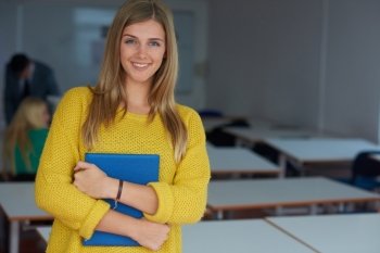 portrait of young female student at school classroom