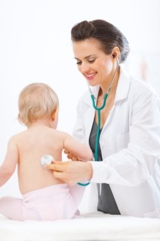 Pediatric doctor examine baby using stethoscope