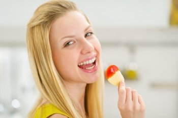 Portrait of smiling teenage girl with chips
