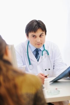 Medical doctor attentively listening patients