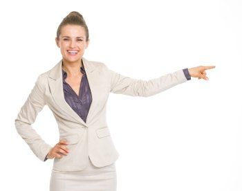 Happy business woman pointing on copy space