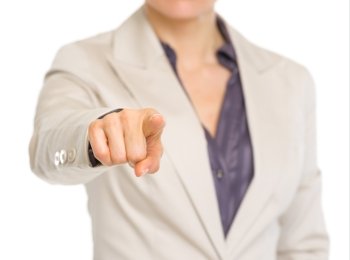 Closeup on business woman pointing in camera