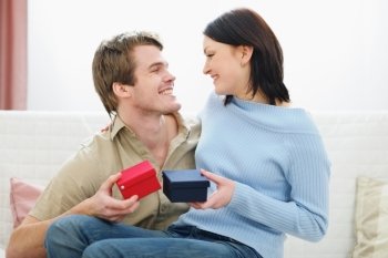 Romantic couple exchanging presents