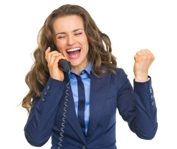 Happy business woman talking phone and rejoicing