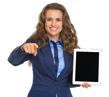 Business woman holding tablet pc with blank screen and pointing in camera