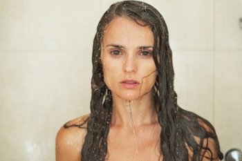Portrait of young woman in shower