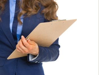 Closeup on business woman with clipboard