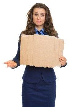 Frustrated business woman with hand outstretched for alms showing blank cardboard
