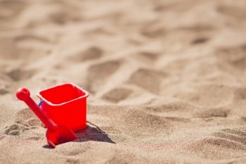 Baby bucket and shovel on the sandy beach