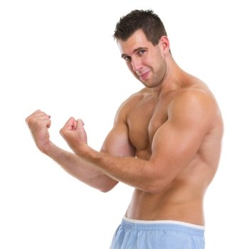 Strong sports man showing biceps