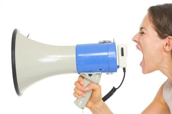 Young woman shouting through megaphone