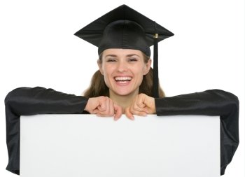 Happy graduation student girl with blank billboard