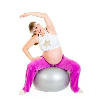 Smiling beautiful pregnant woman doing exercises on  fitness ball isolated on white 
