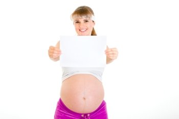 Smiling beautiful pregnant woman holding empty white  paper isolated on white
