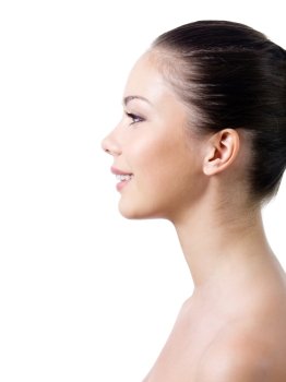 Beautiful young woman’s face with healthy clean fresh skin in profile - isolated