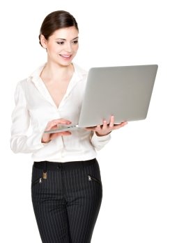 Portrait of a  beautiful smiling woman holds laptop on hands- isolated on white. 
