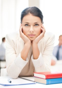 business and education concept - stressed businesswoman in office