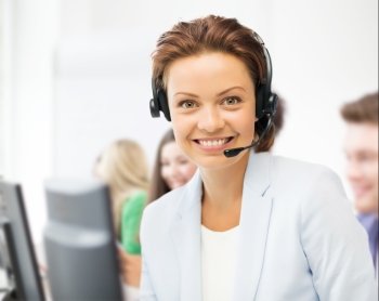 business and call center concept - helpline operator with headphones in call centre