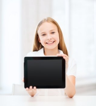 education, school, technology and internet concept - little student girl with tablet pc at school