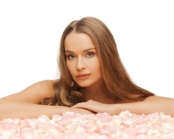 health and beauty concept - beautiful woman with rose petals