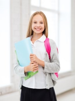 education and school concept - happy and smiling teenage girl